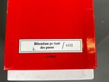 a close up of a red box with a white label on it