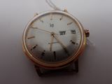 a close up of a wrist watch on a white surface