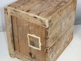 a small wooden box with a metal latch on it