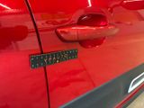 a close up of a car door handle with a sticker on it