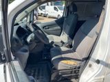 the interior of a white van with two seats and a steering wheel