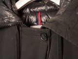 a black jacket with a red, white, and blue stripe on it