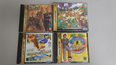 Quatre CD de divers films d'animation sont posés sur une table