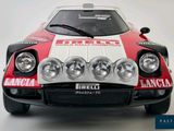 a red and white race car on a white surface