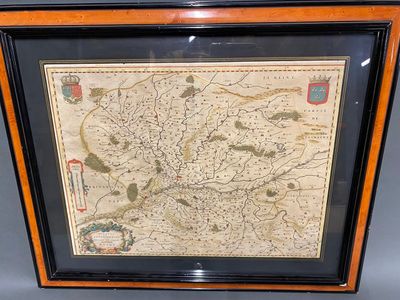 a framed map of the city of london in a wooden frame
