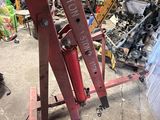 a picture of a large red machine in a garage