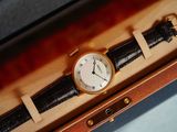 a watch that is sitting in a box on a table