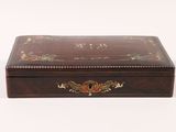 an old wooden box with a decorative design on it