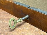 a key that is attached to a wooden door