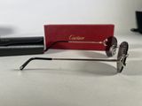 a pair of glasses sitting on a table next to a red box