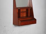 a wooden shelf with a mirror on it in a room