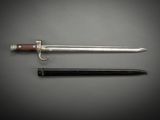 two swords and a knife on a gray background