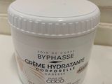 a close up of a container of cream on a counter