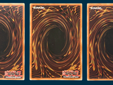 three cards with a picture of a black hole in the middle of them
