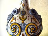 a vase that is sitting on a table in front of a wall