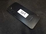 the back of a black samsung phone with a number plate on it
