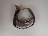 a brown leather strap with a metal hook on it