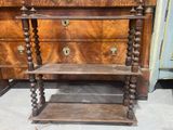 a wooden shelf that has a shelf on top of it