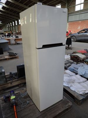 a refrigerator that is sitting on a pallet in a warehouse