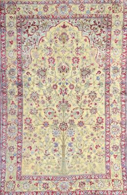 a yellow and red rug with a tree of life on it