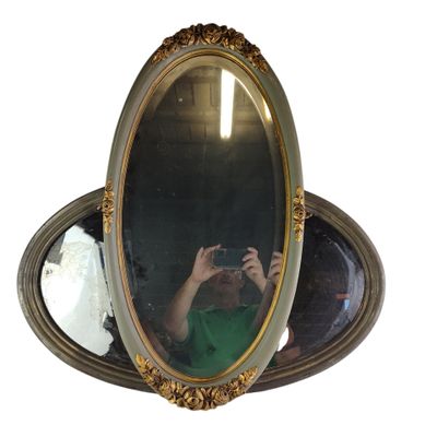 a man taking a picture of himself in a mirror