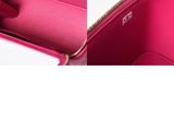 the inside of a pink purse with a zipper on the inside