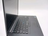 a black laptop with a black keyboard on a white surface