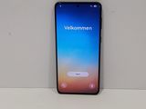 the back of a black samsung s9 phone sitting on top of a white table