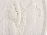an image of a white relief of a woman holding a bird