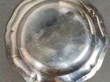 a silver plate that is sitting on a table