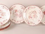 four plates with floral designs are stacked on top of each other