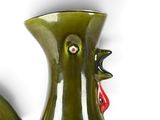 a green vase with a red handle on a white background