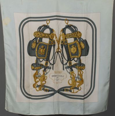 a picture of a blue and gold scarf hanging on a wall