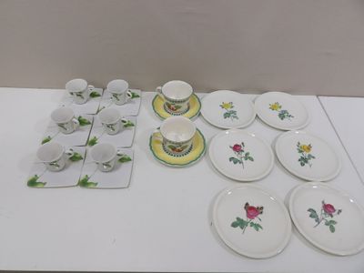 a lot of plates and cups on the table