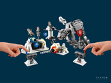 two hands that are holding a lego star wars set