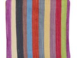 a multicolored striped rug on a white background