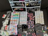 many different types of jewelry on display on the couch