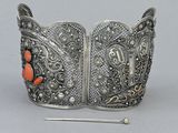 silver cuff bracelet with coral beads and filigree accents