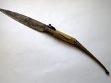 a knife that is laying on top of a table