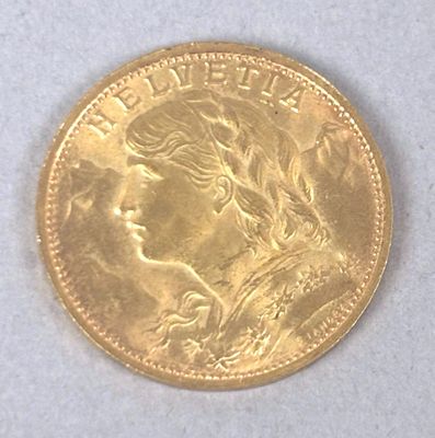 l'image d'une pièce d'or sur laquelle figure le visage d'une femme