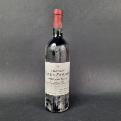 a bottle of wine sitting on top of a table