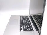 a close up of a laptop computer on a white surface