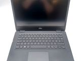 the dell laptop is open and ready to be used
