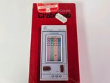a red box with a game on it on a table