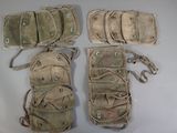 several different types of military pouchs are laid out on a white surface