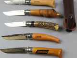 six different types of knives are lined up on a table