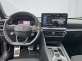 the interior of a car with a steering wheel, dashboard, and touch screen