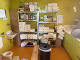 a room that has a lot of items on the shelves