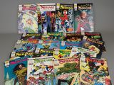 a collection of comic books on a table