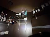 a man that is standing on a ladder in a room